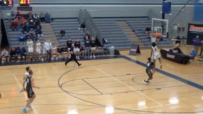 Screenshot from viral video where announcer brings up dead dog during dunk